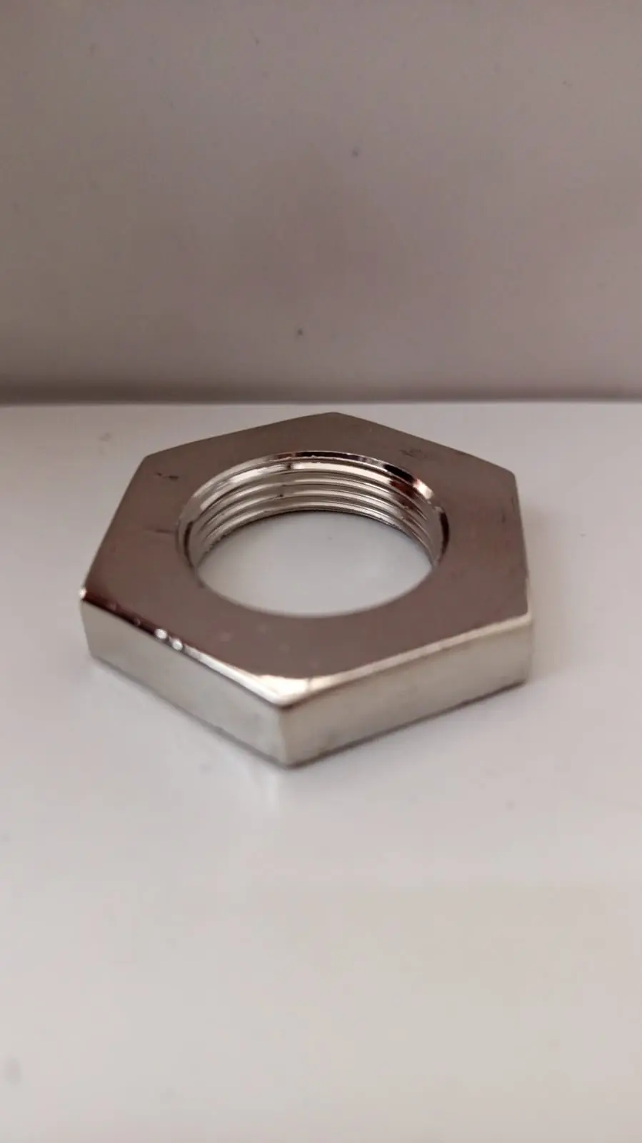 TUERCA LG PLANA CROMADA GENERICA CKD91485